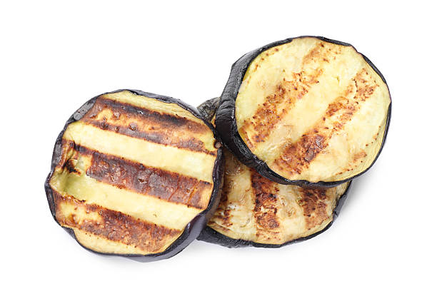 istock Slices of grilled eggplant isolated on white, top view 2242437446