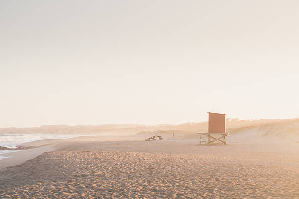 A stunning view of El Barco Beach in La Pedrera, where the deserted sands are marked by the haunting remains of a shipwrecked vessel.