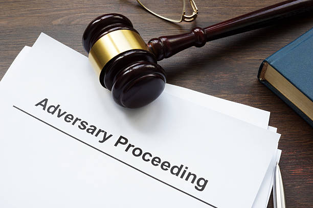 istock A stack of papers about Adversary proceeding, gavel and glasses. 2242442063