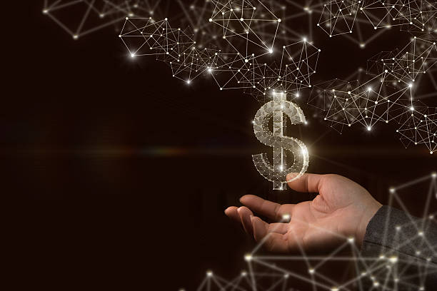 istock Shining dollar symbol held in hand among scattered lights. 2242445512