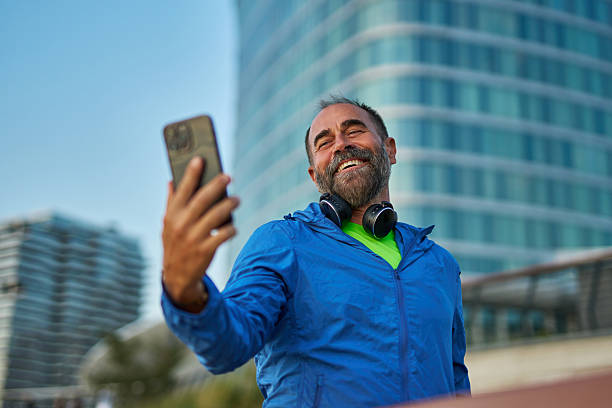 istock Mid adult man taking selfie during urban exercise 2242446700
