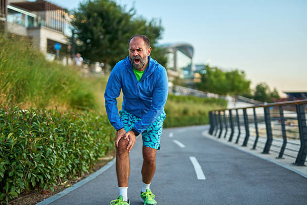 istock Mature adult man experiencing knee pain while running 2242446736