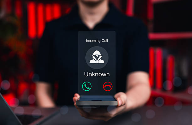 istock Fraud and Phishing Concept with Unknown Caller Alert. A phone displaying an incoming call from an unknown number, symbolizing fraud, phishing, and spam call warnings. scammer or stranger, Prank caller 2242447837