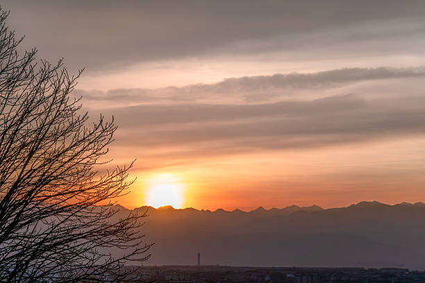 View of the sunset over the Alps from Turin