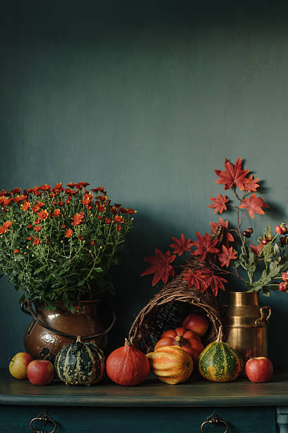 istock Thanksgiving  floral decor background with cornucopia and pumpkins 2242459640