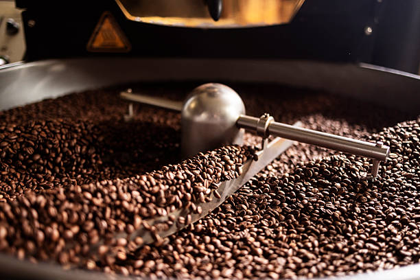 istock Industrial Coffee Roasting Drum With Nutty Beans In A Hot Roaster Machine 2242459947