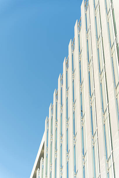istock Modern Glass Office Building Against Blue Sky 2242461826