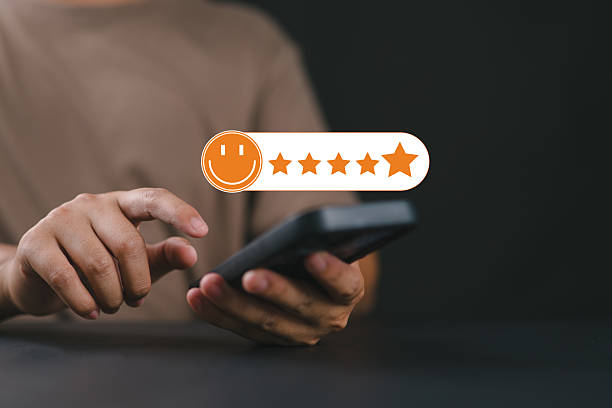 istock Customer feedback and satisfaction rating, businessperson using smartphone to give five-star review, representing digital user experience, service quality, and online reputation management. 2242463707