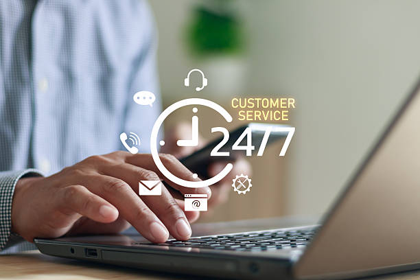 istock 24-7 customer service support concept showing person using laptop and smartphone with digital communication icons, online help desk, business assistance and continuous client support technology. 2242464952