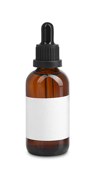 istock Brown bottle with tincture isolated on white 2242466729