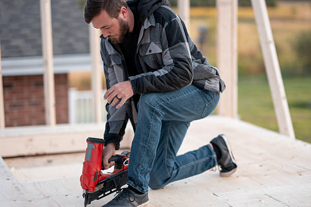 istock Man On Construction Site Using Nail Gun For Wood Frame Assembly During Renovation 2242470969
