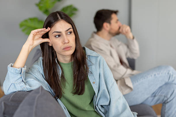 istock Couple's Tense Moment with Emotional Distance Between Them 2242471760