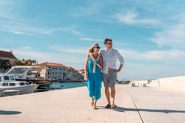 istock Mature Caucasian Couple Strolling Adriatic Coast 2242471819