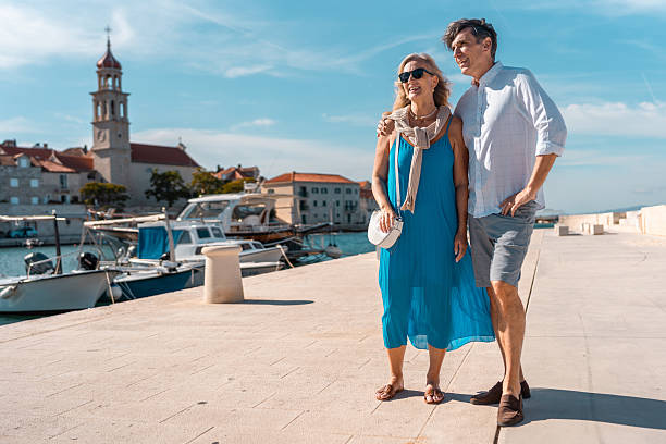 istock Mature Caucasian Couple Strolling Sutivan Harbor 2242471830
