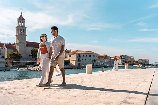 istock Lovely Couple Strolling in Coastal Sutivan 2242471833