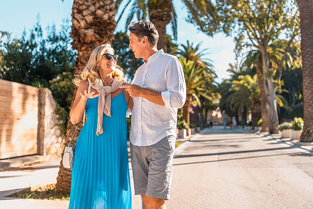 istock Elegant Mature Couple Strolling Adriatic Promenade 2242471855