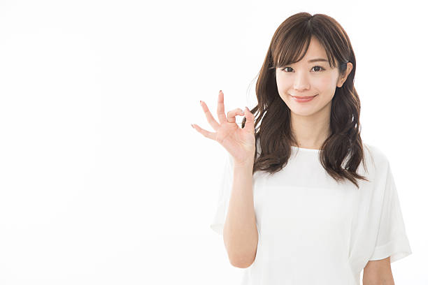 istock A woman giving an ok sign 2242474256
