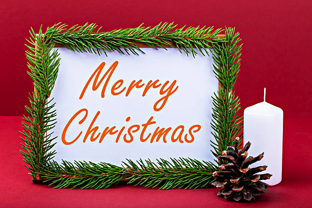 Merry Christmas. Festive holiday greeting card surrounded by fresh pine branches, white candle, and pine cone, set against vibrant red background, creating warm and inviting seasonal atmosphere