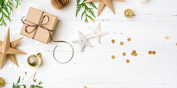 istock Festive Christmas background with gift box and Christmas decorations 2242479454