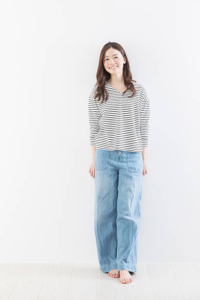 Woman leaning against wall