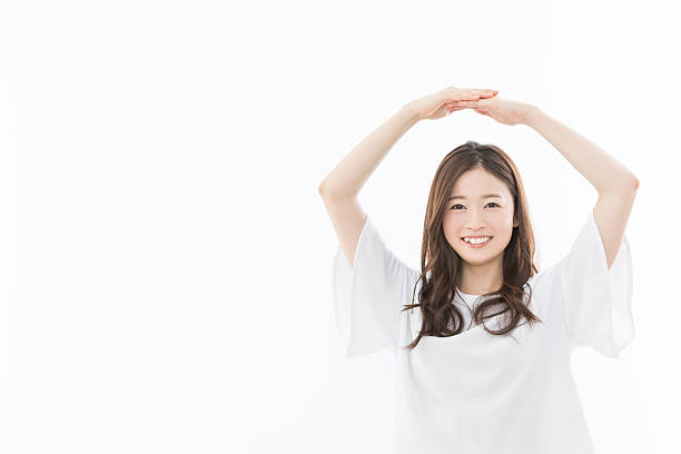 istock A woman giving an ok sign 2242480566