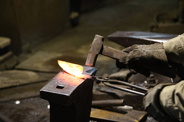 istock A craftsman who hammers heated materials into shapes 2242480582