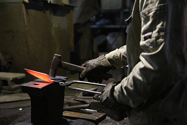 istock A craftsman who hammers heated materials into shapes 2242480613