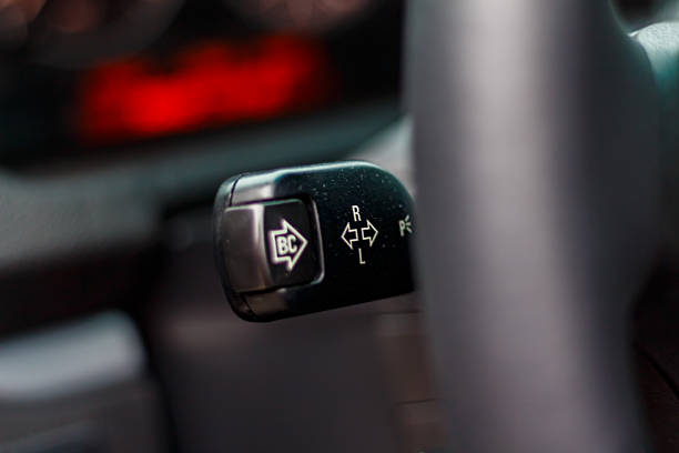 Modern Car Interior: close-up of details, steering wheel, dashboard, control buttons, leather cabin.