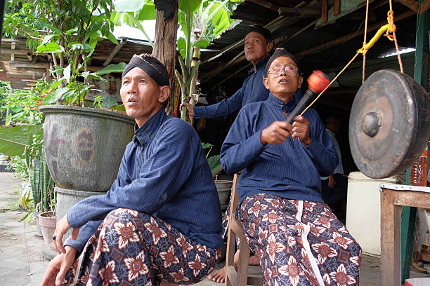 Yogyakarta, Indonesia, May 14, 2016. Abdi dalem Pakualam is tasked with hitting a small gong to supervise the traditional archery competition.