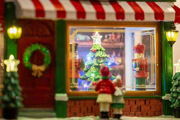 istock Children admire a Christmas display with a decorated tree and nutcracker figures 2242481383