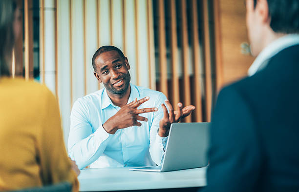 istock Confident team leader leading a discussion in a modern office 2242481403
