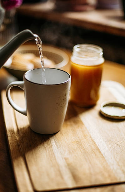 istock Pouring hot water into a white cup 2242484346