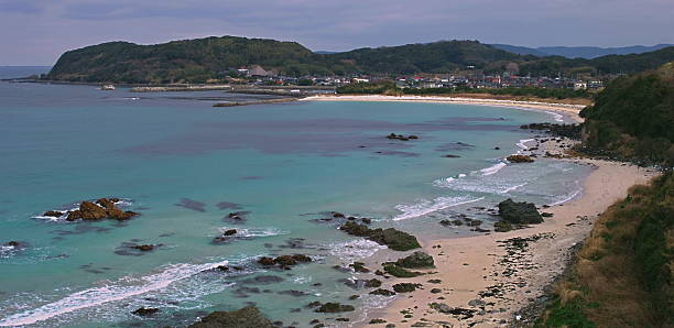 istock Pristine coastal bay with turquoise waters and sandy beach shoreline 2242484578