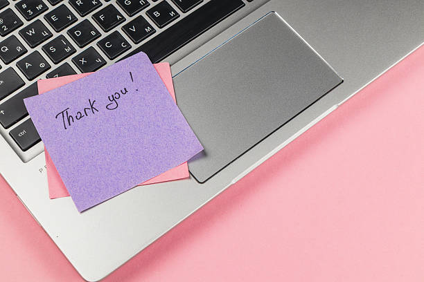 istock Notes of gratitude on a laptop next to colorful sticky notes 2242491417