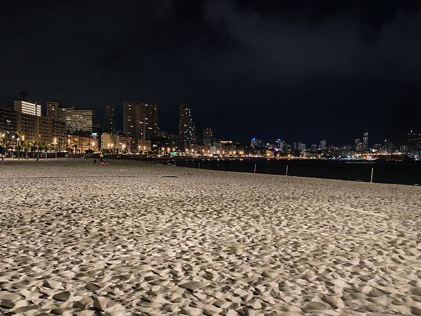 istock silent night shoreline, calm beach beneath cloudy sky, serene and quiet beach with cloudy night sky 2242491729