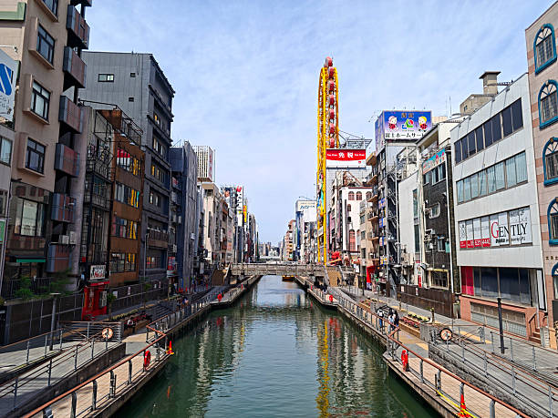 View of the Dotonbori canal. Dotonbori is a famous commercial and nightlife area in downtown Osaka, Japan.