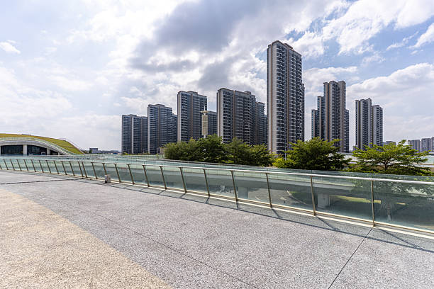 istock City buildings in front of empty road 2242492009