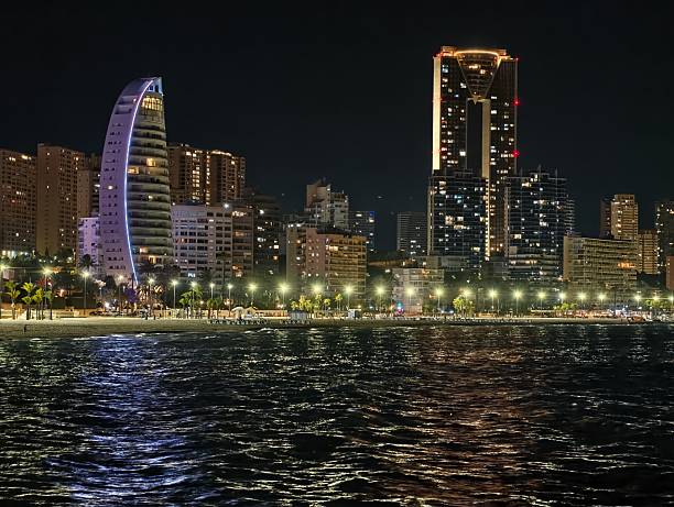 istock waterline view with shimmering reflections, gentle ripples and illuminated towers create atmosphere 2242494247