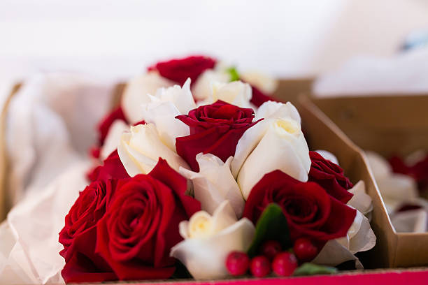 Close up shot of a beautiful bouquet of pink and white roses on a table with copy space.