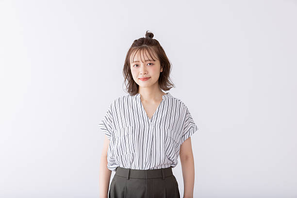 istock Asian woman with bun hair 2242499347