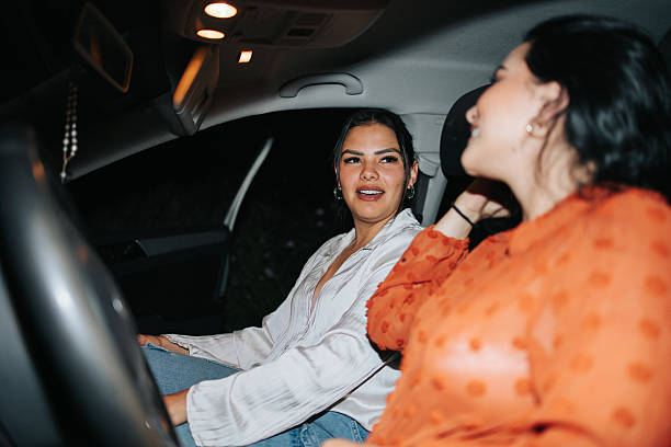 istock Close friends chatting in the car after work 2242499781