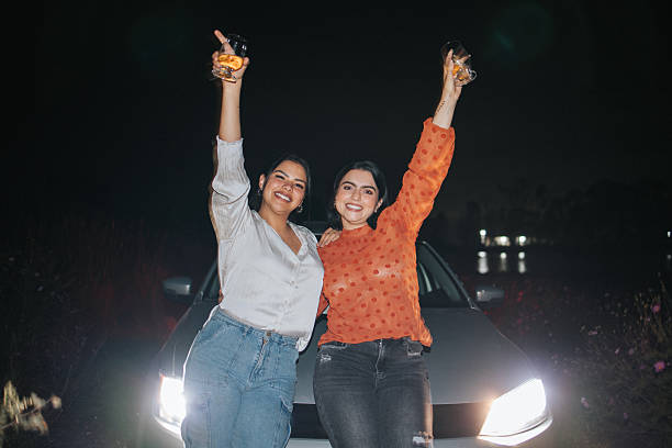istock Young female friends drinking and having fun at night 2242500512