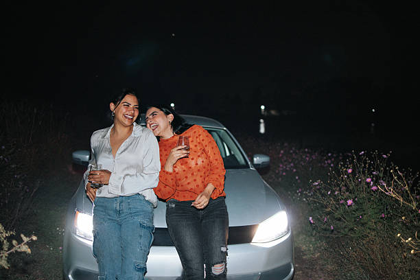 istock Young female friends drinking and having fun at night 2242500513