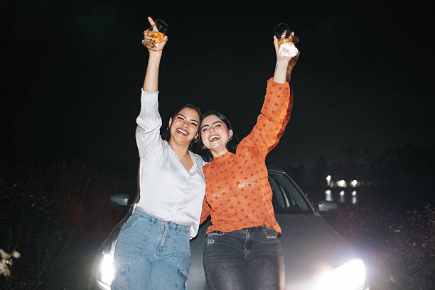 istock Young female friends drinking and having fun at night 2242500525