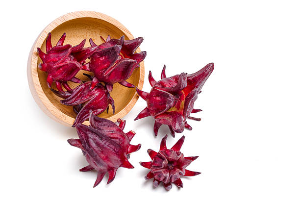 istock Top view fresh roselle fruit in wood bowl on white background. 2242500756