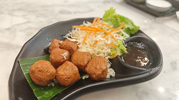 istock Fried shrimp ball served with sweet plum sauce. 2242505859