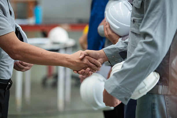 istock Engineers and workers group portrait in steel factory, showing teamwork and collaboration. 2242506865