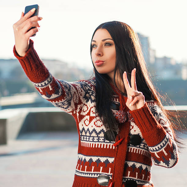 istock Beautiful woman doing Selfie on phone 2242506930