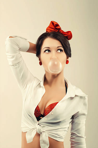 istock Pinup woman with cud in studio. Back to 1950s 2242508096