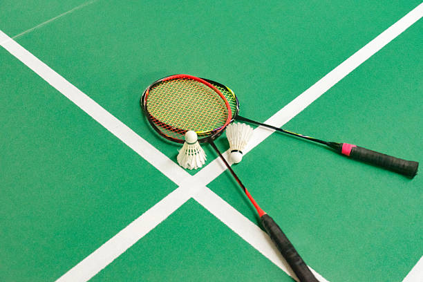 istock Badminton Sports rackets and shuttlecocks on green floor. 2242508268